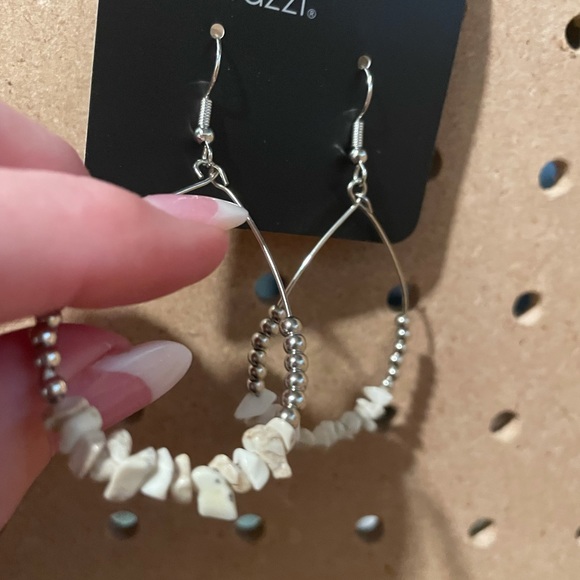 Off white shark teeth/river rock stones on silver teardrops.